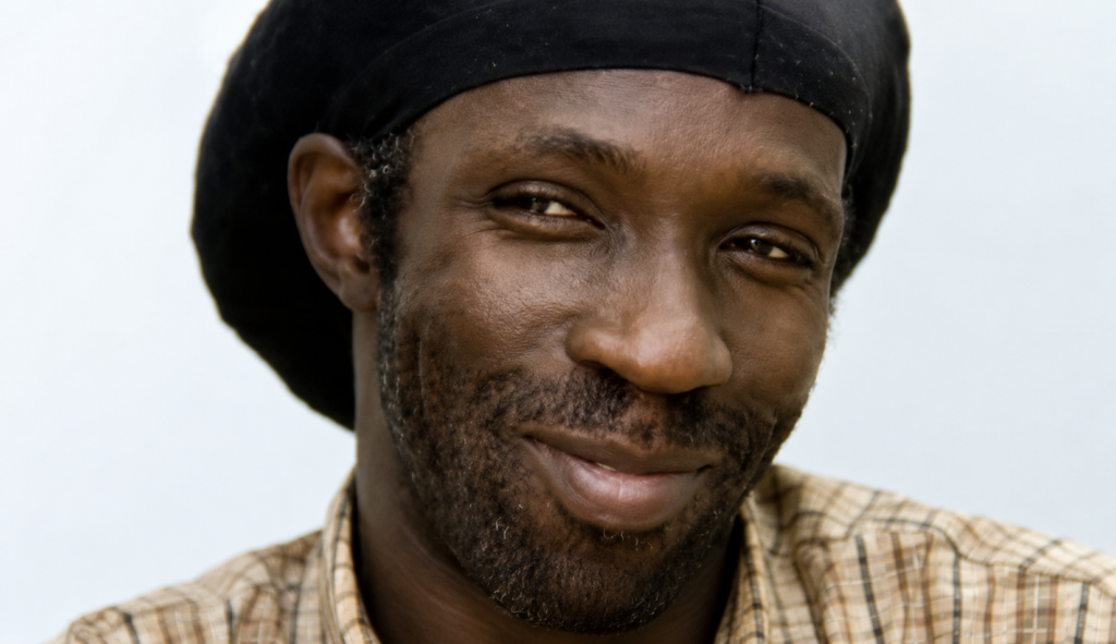 Image of person wearing black cap